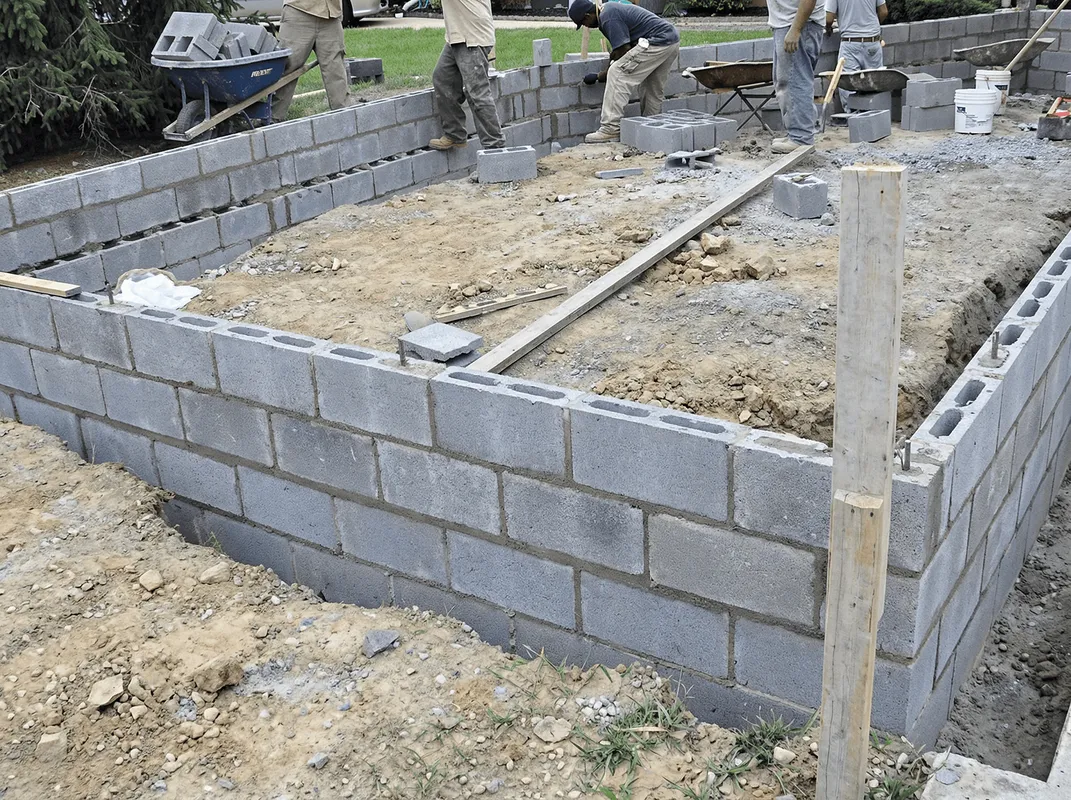 Professionals building a foundation with blocks in Oakland, CA