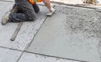 Professional repairing a concrete floor in Oakland, CA